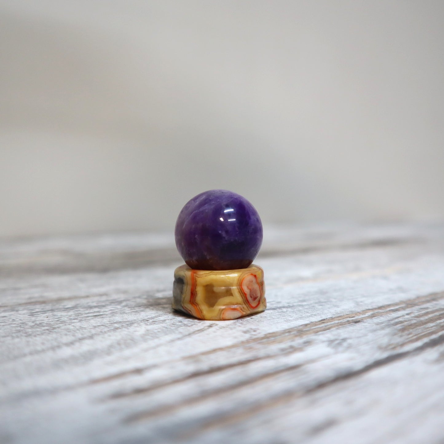 Amethyst Mini Sphere on Crazy Lace Agate Stand