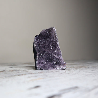 Purple amethyst cut base crystal with sparkling druzy for calm and clarity.