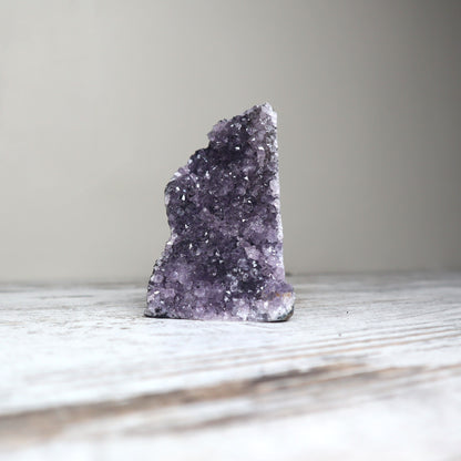 Purple amethyst cut base crystal with sparkling druzy spiritual connection and purification.