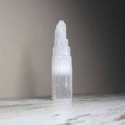 Selenite tower with white striations for energy cleansing.