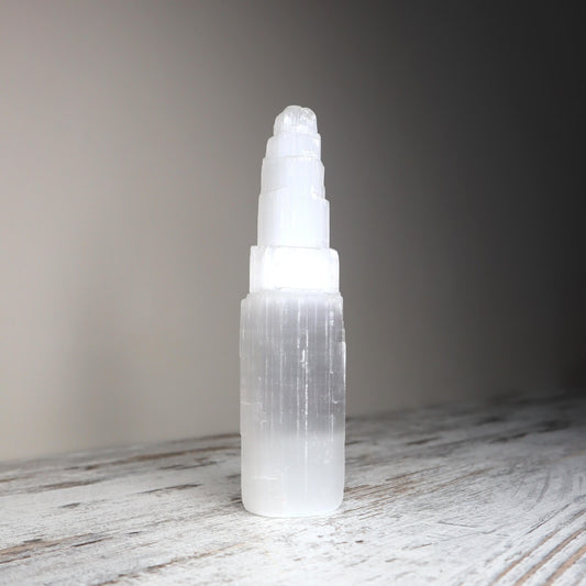 Selenite skyscraper-style crystal used for aura purification.